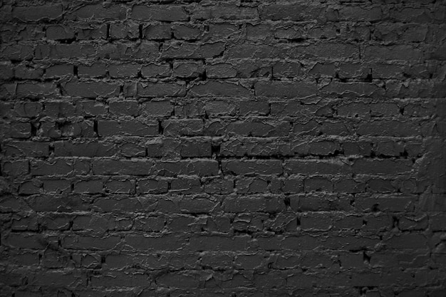 古いレンガの壁 抽象的な黒の背景 黒レンガのテクスチャ 暗い粗面 プレミアム写真