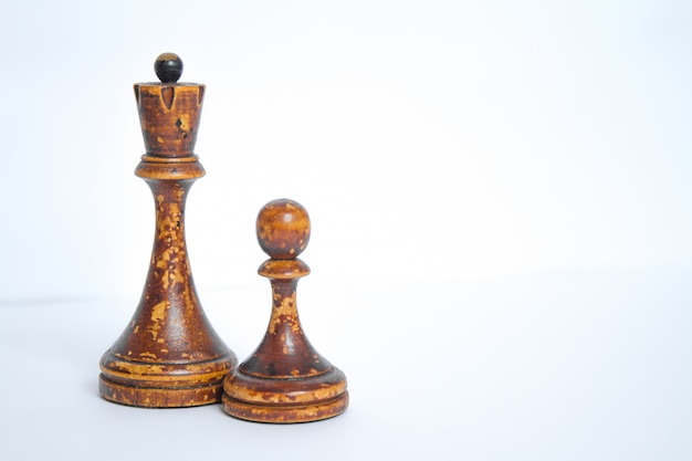 Premium Photo | Old chess board with wooden pieces.