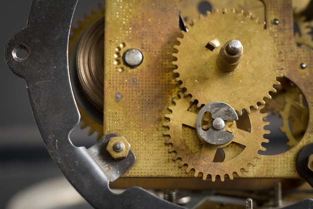 Premium Photo | Old clock mechanism with gears and cogs.