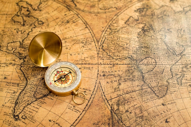 Premium Photo Old Compass On Vintage Map