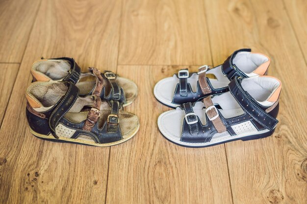 Premium Photo | Old and new children's orthopedic shoes. thomas heel ...
