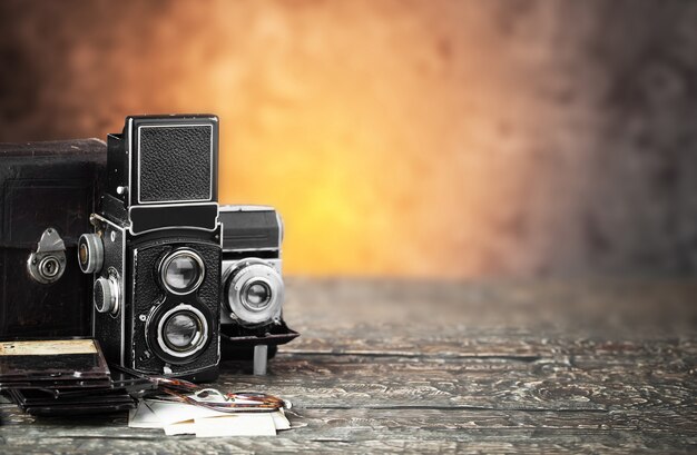 Premium Photo | Old photo camera on old background