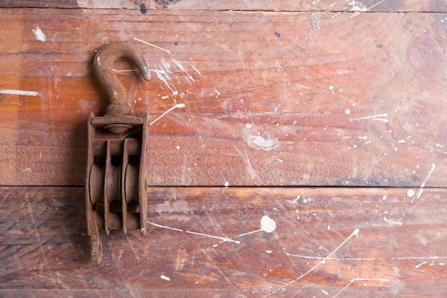 Premium Photo | Old pulley on wooden background