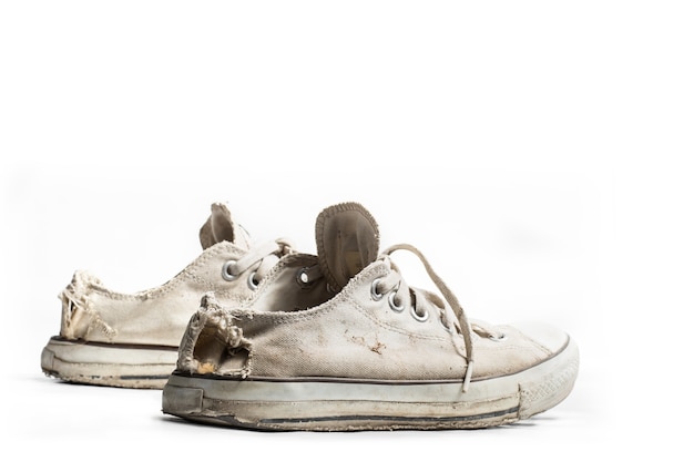 Premium Photo | Old sneakers isolated on white