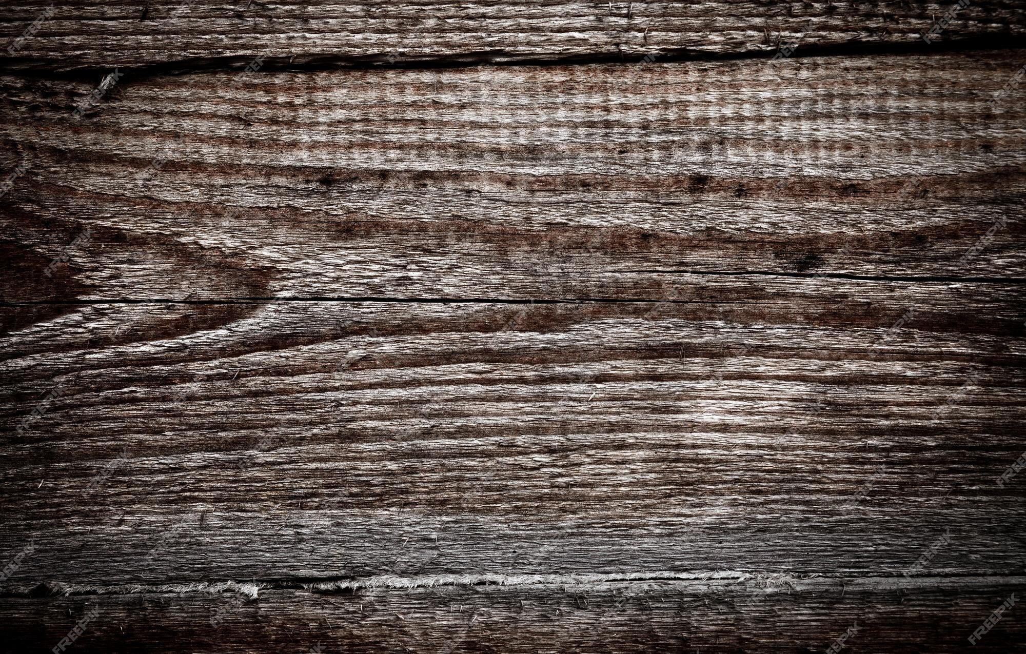 Premium Photo | Old stained board. a dark background