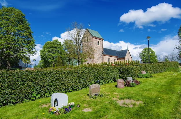Premium Photo | Old sweden church with cemetery in town near stockholm - vallentuna, vivid sweden background