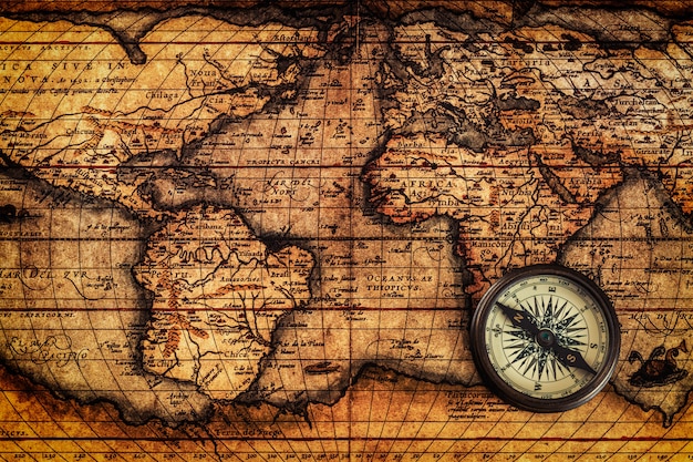 Premium Photo  Old vintage compass on ancient map