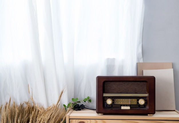 Old Vintage Radio With Shelf On Wooden Cabinet Photo Premium