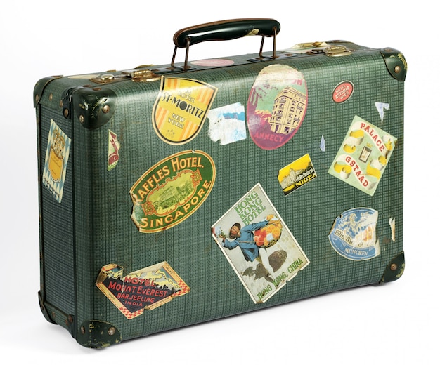 old suitcase with travel stickers