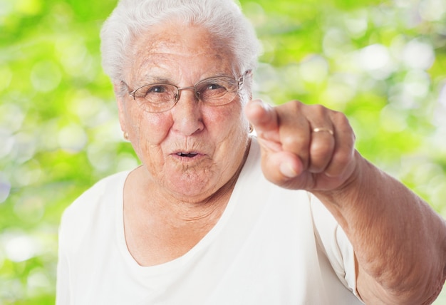 Old woman pointing Photo | Free Download