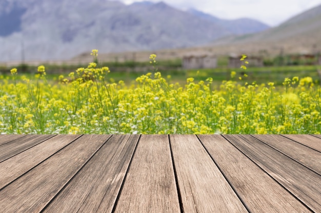 Premium Photo Old Wooden Board With Mustard Flower Field Background