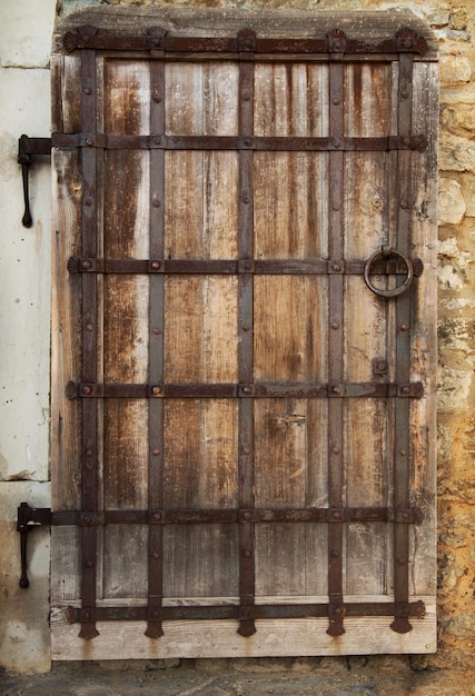 Premium Photo | Old wooden door in a stone wall