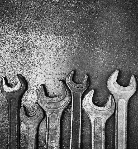 premium-photo-old-wrenches-on-a-metal-table-bw-photo