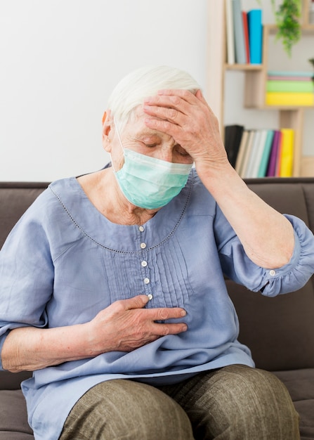 Free Photo Older Woman With Medical Mask Feeling Sick 0970