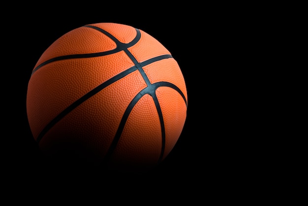 Premium Photo | One basketball on black background