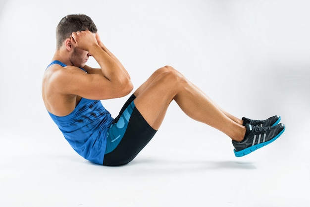 Premium Photo | One caucasian man exercising crunches fitness weights ...