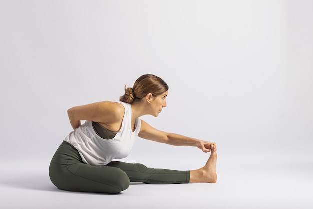 Premium Photo | One leg folded forward bend pose. yoga posture (asana)