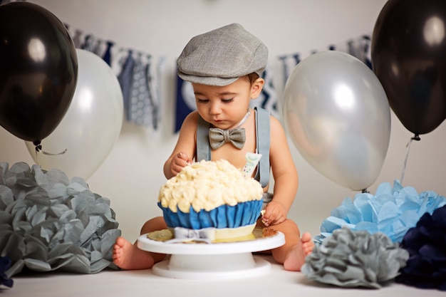 Premium Photo | One-year-old cute boy on a gray background