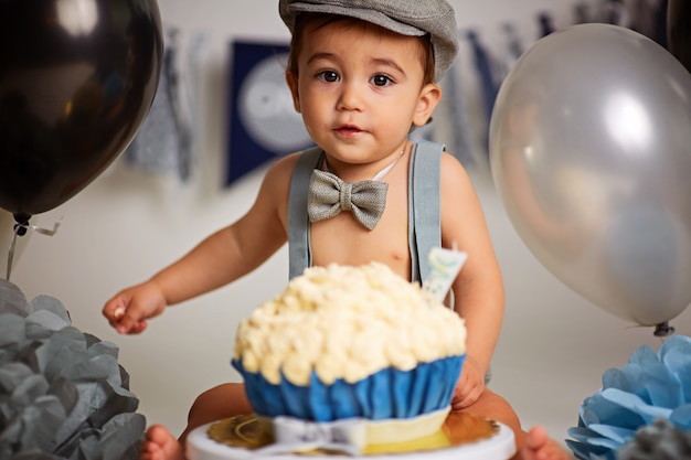 Premium Photo | One-year-old cute boy on a gray background