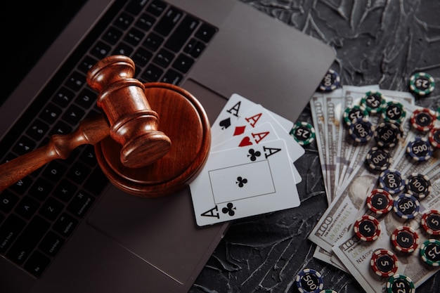 Premium Photo | Online gambling and justice theme, cards, playing chips ...