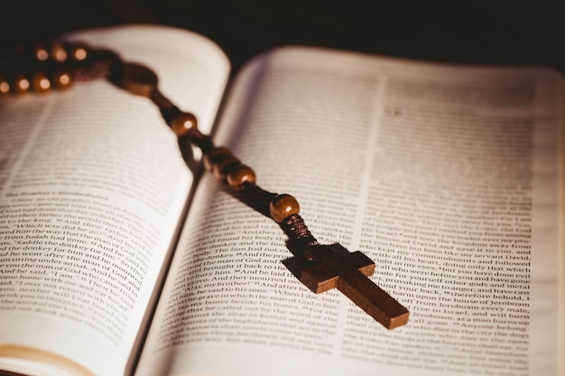 Premium Photo | Open bible with rosary beads