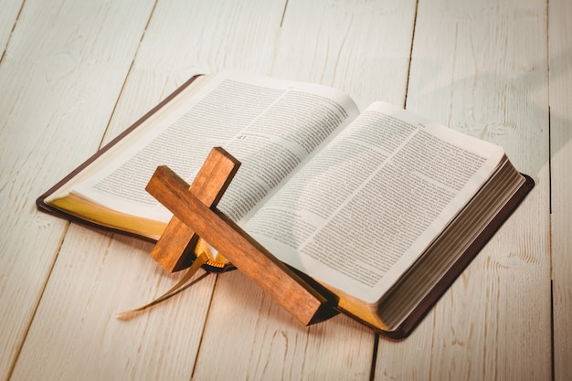 Premium Photo | Open bible and wooden cross