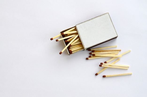 Download Open cardboard matchbox filled with matches on a white background | Premium Photo