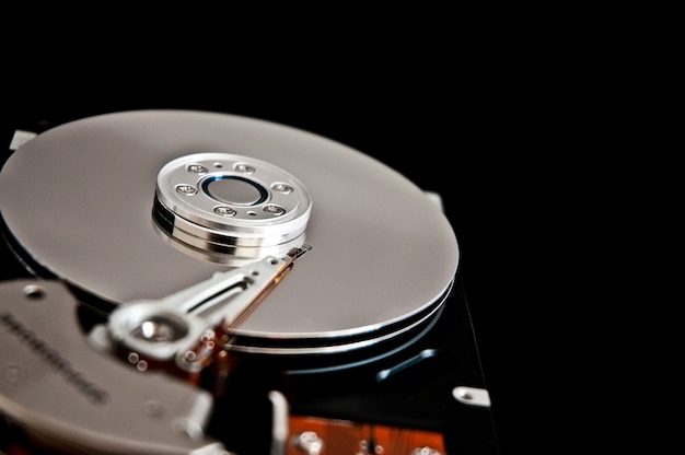 Open hard disk on a black background Free Photo