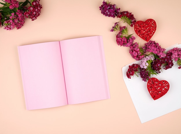 Premium Photo | Open notebook with pink blank pages