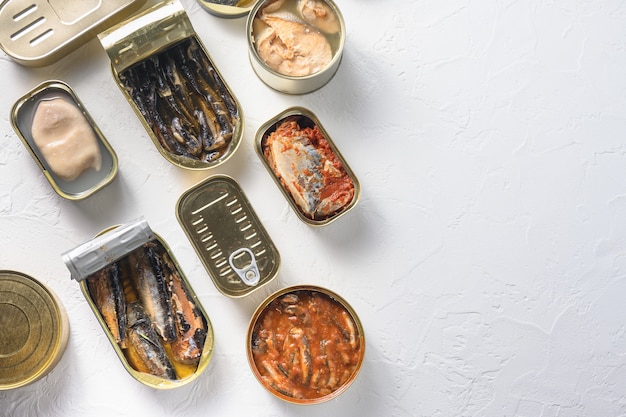 Premium Photo Opened Cans With Different Types Of Fish