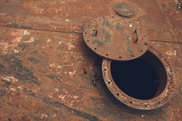 Premium Photo Opened Rusty Manhole On The Black Fuel Tank Fixed Cone