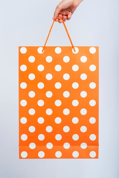 white and orange bag