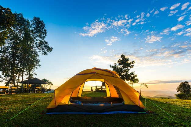 Premium Photo | Orange tent glows under sky.