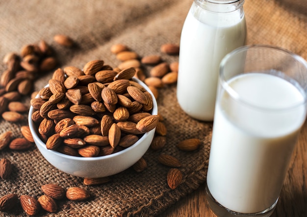 Organic almond milk and almonds Free Photo