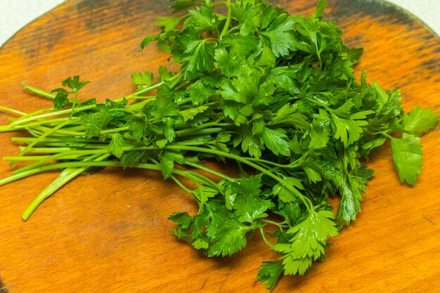 Premium Photo Organic Italian Parsley Closeup On Rustic Wooden Table Healthy Vegetarian Food