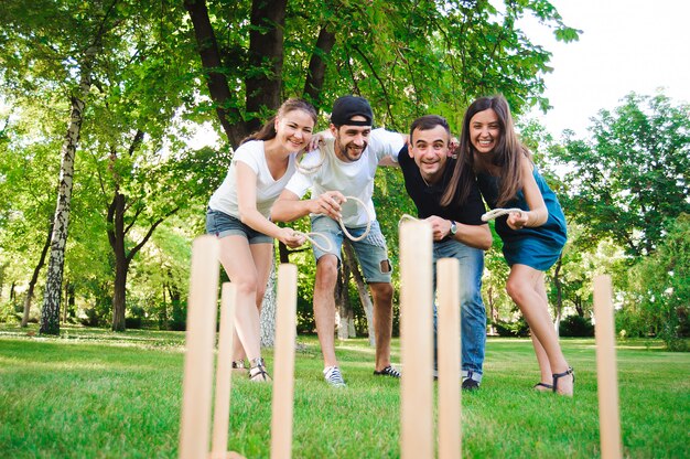 Premium Photo | Outdoor games, ring toss, friends playing ring toss in ...