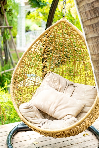 Premium Photo | Outdoor patio with wicker swing chair
