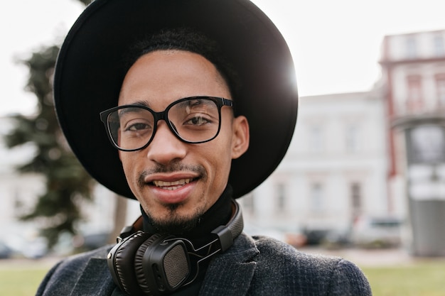 Free Photo | Outdoor photo of smiling african young man in big hat ...