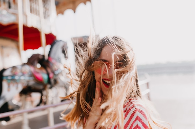 Free Photo Outdoor Shot Of Blissful Cute Girl Expressing Positive