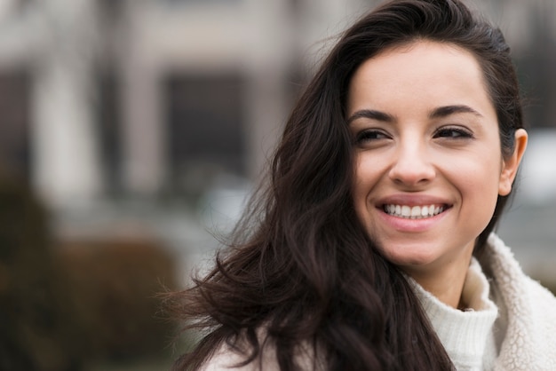 Free Photo | Outdoors portrait of smiley woman