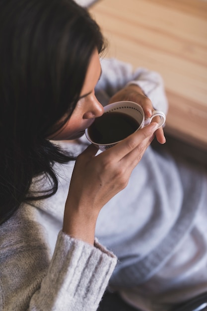 Free Photo | An overhead view of girl drinking coffee