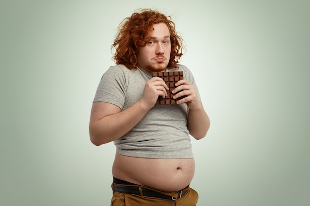 Free Photo Overweight Fat Man With Ginger Curly Hair Looking
