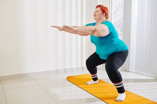 Premium Photo Overweight Woman Doing Squats