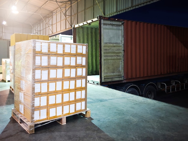 Premium Photo | Package boxes loading with shipping cargo container ...