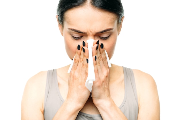 Premium Photo | Painful woman with runny nose, snot or flu