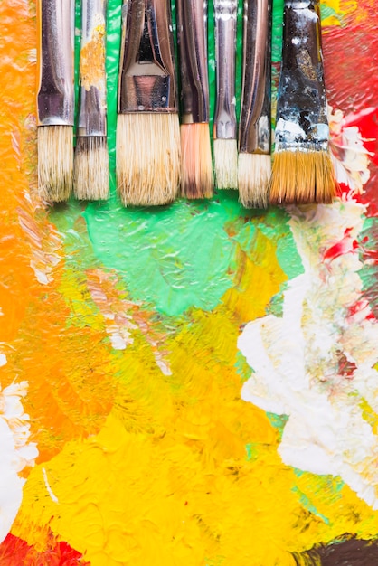 Free Photo | Paintbrushes on strokes of paint