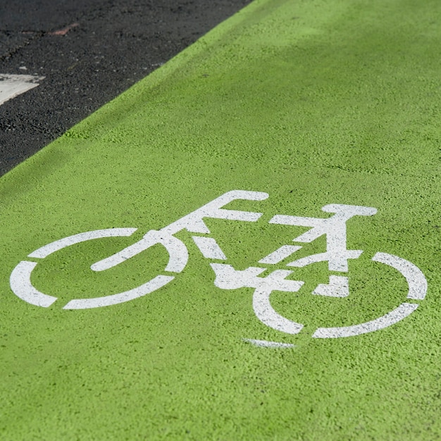 Premium Photo | Painted bicycle path stencil on road