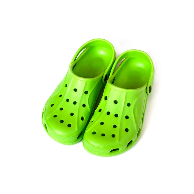 Pair Of Bright Green Clogs Isolated On White Surface Premium Photo