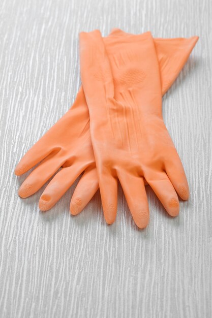 Premium Photo | Pair of gloves on wooden desk