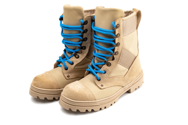 Pair of military boots with blue laces